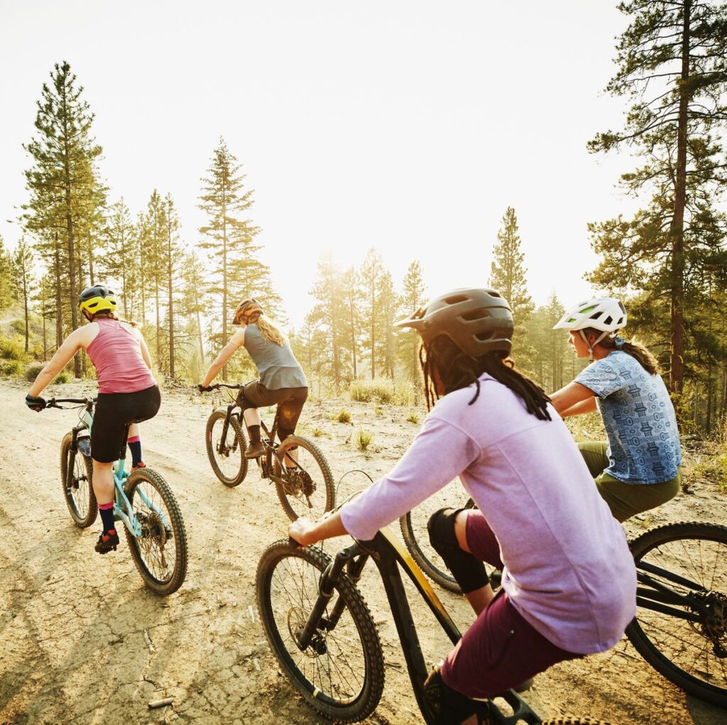 Group of female mountain bikers taking part in outdoor exercise