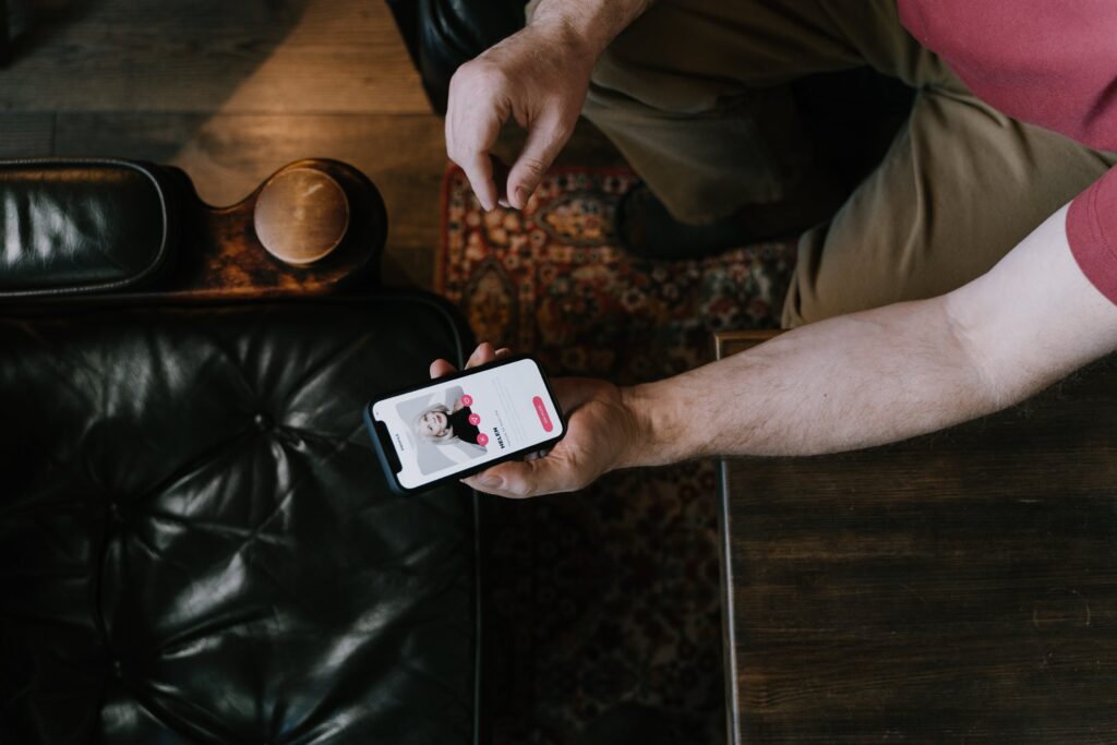 Online Dating - Man looking at dating app on phone